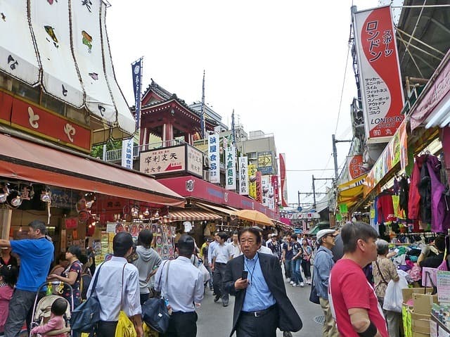 people walking around a street in Tokyo