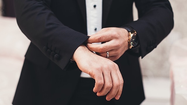 man wearing a black suit