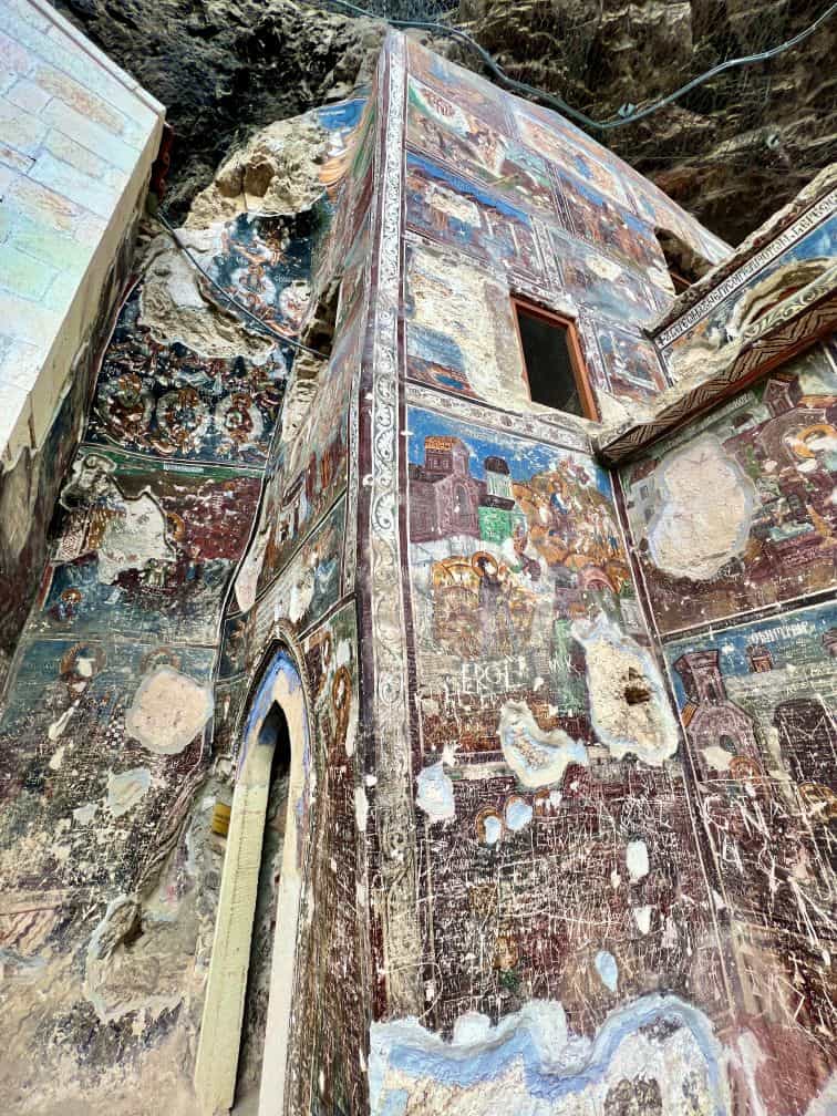 Damaged frescoes on the outside of the church